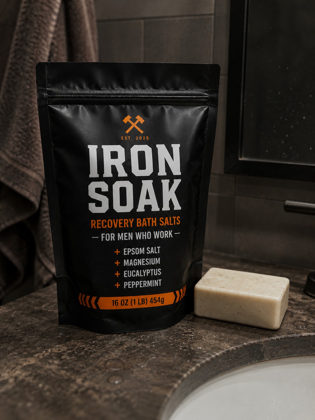 Iron Soak Recovery Bath Salts on bathroom counter next to bar soap