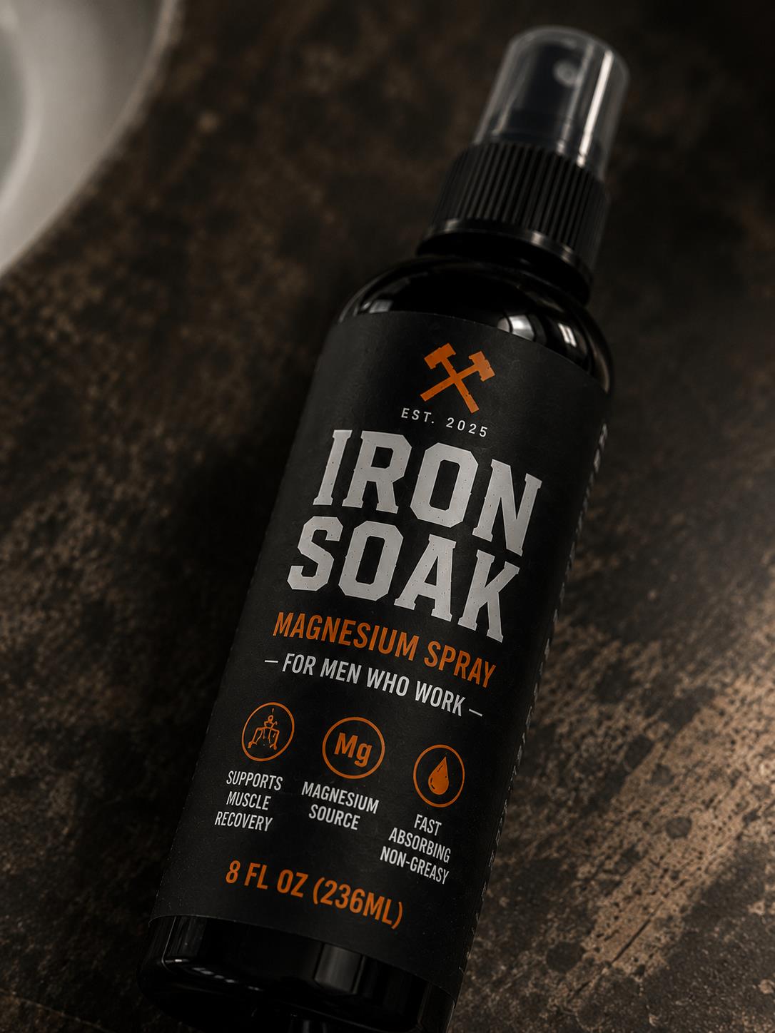 Iron Soak magnesium spray bottle label closeup showing ingredients and branding.
